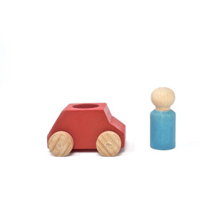 Red wooden car with turquoise figure